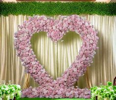 a large heart made out of pink flowers