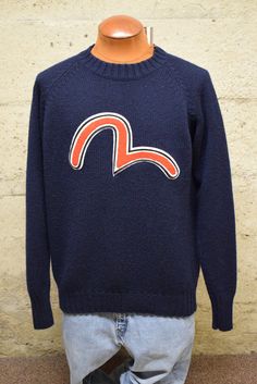 "Vintage Evisu Embroidered Big Logo Knitted Crewneck Wool Blend Sweater 90's XL/XXL Measured Size   Under Arm to Under Arm 23\" Top to Bottom 27\" Collar to Cuff 31\" Excellent condition.    We sell 'As Is\" We extensively look over every garment that we post on Etsy. However, things do get missed. While we want our clients to love each piece as much as we do some things won't be up to some standards. We ask that you keep in mind that these are vintage pieces that hold an individual character pr Logo Knit, Wool Blend Sweater, Wool Blend, Gender Neutral, Crew Neck, Wool, Adult Outfits, Sweatshirts, ? Logo