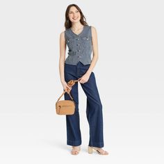 This Button-Front Denim Vest from Universal Thread™ will make a cool addition to your denim collection. Made from midweight cotton fabric with added stretch in a regular fit, it offers comfortable all-day wear. The flattering V-neckline, button-front design and chest flap pockets add touches of classic style. You can wear this sleeveless denim vest with high-waist pants, skirts and more for a variety of chic ensembles. Universal Thread™: Found exclusively at Target. Trendy Cotton Denim Vest With Snap Buttons, Medium Wash Casual Denim Vest With Buttons, Casual Medium Wash Denim Vest With Buttons, Casual Medium Wash Jeans With Snap Buttons, Casual Dark Wash Denim Vest With Buttons, Denim Blue Denim Vest With Snap Buttons, Medium Wash Denim Vest With Pockets For Work, Workwear Medium Wash Denim Vest With Pockets, Casual Button-up Denim Vest With Button Closure