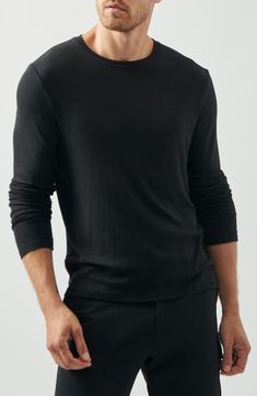 A classic for a reason, this ribbed long-sleeve T-shirt can easily be layered with all of your favorite looks. Crewneck Long sleeves 95% modal, 5% spandex Hand wash, dry flat Made in Peru Black Long Sleeve Fine Knit Top, Black Fine Knit Long Sleeve Tops, Black Long Sleeve Everyday T-shirt, Classic Long Sleeve Tops For Everyday, Classic Long Sleeve Relaxed Fit T-shirt, Classic Everyday Tops With Ribbed Cuffs, Classic Tops With Ribbed Cuffs For Everyday, Long Sleeve T-shirt With Ribbed Neckline, Black Long Sleeve T-shirt For Everyday