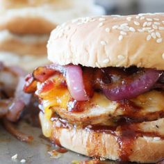 a bacon cheeseburger with onions on the side