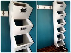 two white shelves with black labels on them in the corner of a blue walled room