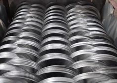 several rolls of steel are stacked on top of each other