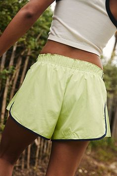 So comfy and active-ready, these billowy shorts feature a high-rise fit and smocked elastic waistband with pleated detailing at the sides. **Fit:** Relaxed fit, shorty-length, pull-on style **Features:** Lightweight and breathable fabrication, smocked elastic waistband, contrast seams, pleated side detail for added dimension **Why We | Easy Tiger Shorts by FP Movement at Free People, Keylime Combo, S Spring Athletic Shorts With Built-in Shorts, Spring Athletic Shorts With Elastic Waistband, Spring Sports Shorts With Drawstring, Spring Athleisure Athletic Shorts With Drawstring, Spring Sports Drawstring Shorts, Sporty Bottoms With Short Inseam For Spring, Sporty Spring Bottoms With Drawstring, Sporty Short Inseam Bottoms For Spring, Spring Workout Athletic Shorts With Elastic Waistband