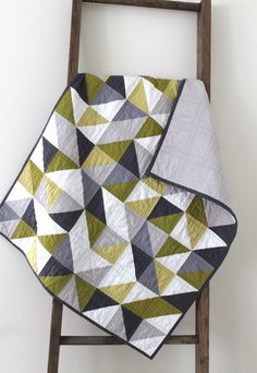 an image of a quilt that is on top of a ladder and has been made into a blanket