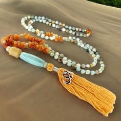 - Handcrafted Amazonite W/ Orange Aventurine Gemstone & Jade Buddha Guru Bead Mala Necklace I Made This Mala With The Traditional 108 Beads. Sizes: (6mm) Semi-Precious Gemstone Beads. See All Provided Photos And Photo No. 9 For The Measurements The Beads Are Made From Amazonite, Orange Aventurine & Carnelian With Iridescent Glass Seed Beads In-Between The Amazonite. The Guru Bead Is A Suzhou Jade (Pronounced, "Soochow") Carved Buddha Head With An Aventurine Bead On The Top And Bottom With An Aqu Vishuddha Chakra, Orange Aventurine, Jade Buddha, 108 Mala Beads, Buddha Head, 108 Bead, Mala Necklace, Suzhou, Glass Seed Beads