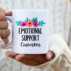 a person holding a coffee mug with the words'emotion support coworker '