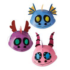 three different types of helmets with horns and eyes on them, one is pink, the other blue