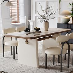 a dining room table with chairs around it