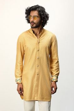 Yellow kurta with thread embroidery and printed cuffs. Paired with a white straight pant. - Aza Fashions Long Sleeve Kurta With Embroidered Cuffs For Eid, Eid Long Sleeve Kurta With Embroidered Cuffs, Designer Embroidered Cuff Kurta For Eid, Eid Fitted Kurta With Embroidered Cuffs, Designer Fitted Kurta With Embroidered Cuffs, Festive Cotton Kurta With Embroidered Cuffs, Fitted Long Sleeve Kurta With Embroidered Cuffs, Fitted Sets With Embroidered Cuffs For Festive Occasions, Traditional Designer Kurta With Embroidered Cuffs