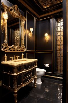 a fancy bathroom with black walls and gold accents on the vanity, toilet and sink