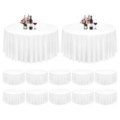 six white round tables with wine glasses and flowers