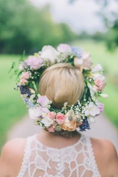 a woman with a flower crown on her head