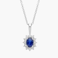 This striking pendant features a deep blue, oval-cut sapphire accented by a halo of round brilliant-cut diamonds set in classic 18k white gold. Suspended from a matching cable chain, this classic sapphire and diamond halo pendant is petite enough for everyday wear, with just the right pop of color for a special occasion. Halo Pendant, Diamond Halo, Round Brilliant Cut Diamond, Brilliant Cut Diamond, Halo Diamond, Cable Chain, Diamond Pendant, Oval Cut, Gemstone Necklace