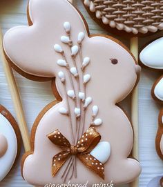 decorated cookies and pastries are arranged on a table