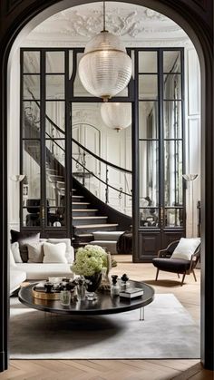 a living room filled with furniture and a spiral staircase