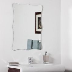 a bathroom with a sink, mirror and towel rack