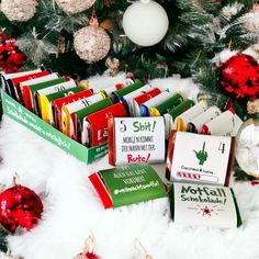 the christmas tree is decorated with books and ornaments