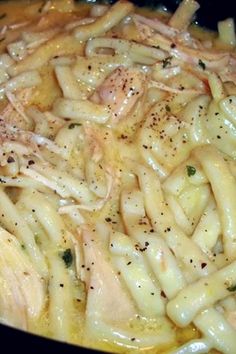 pasta with chicken and parmesan cheese in a skillet