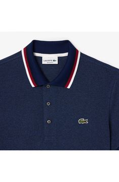 This polo embellished with the signature croc embroidery and a tipped collar is designed for everyday comfort with a classic cut and just-right stretch. Rib collar Short sleeves with rib cuffs 94% cotton, 6% elastane Machine wash, tumble dry Imported Casual Navy Polo Shirt With Embroidered Logo, Casual Blue Polo Shirt With Embroidered Logo, Blue Casual Polo Shirt With Embroidered Logo, Casual Navy Top With Contrast Collar, Dark Indigo, Indigo Blue, Giorgio Armani, Short Sleeves, Size 7