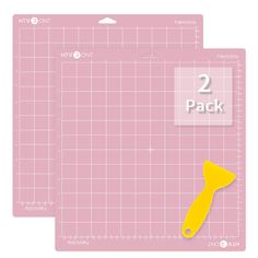 two pieces of pink paper with yellow scissors on them and the words, 2 pack