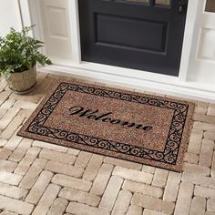 a welcome mat is on the front door