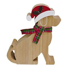 a wooden toy dog with a christmas hat and scarf on it's back legs