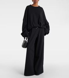 Cotton jersey wide-leg sweatpants in black - Dries Van Noten | Mytheresa Cotton Wide Leg Pants With Ribbed Cuffs, Cotton Wide-leg Pants With Ribbed Cuffs, Oversized Wide-leg Sweatpants, Oversized Cotton Pants With Drawstring, Oversized Cotton Drawstring Pants, High-waisted Wide Leg Cotton Pants, Chic Oversized Cotton Pants, Black Cotton Wide Leg Pants With Drawstring, Wide Leg Sweatpants