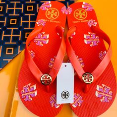 Tory Burch Flip Flop Flat Sandals Gold Logo Red Flying Crazy Logo Discontinued And Hard To Find 100% Authentic As All My Items Stunning!!!!!!!!! Sold Out Online And In Stores!!!!! Made In Cambodia The Quality Is Excellent!!!! Super Fast Shipping!!!!!! Trendy Red Open Toe Flip Flops, Red Trendy Open Toe Flip Flops, Red T-strap Sandals For The Beach, Trendy Red Flat Flip Flops, Trendy Red Sandals For Beach Season, Casual Tan Flat Flip Flops, Red Round Toe Flip Flops For Beach Season, Red Round Toe Flip Flops For Summer, Tan Round Toe Flip Flops For Summer