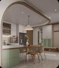 an open kitchen and dining room area with white tile flooring, green cabinets and wooden accents