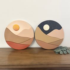 two plates sitting on top of a wooden table next to each other with an egg in the middle