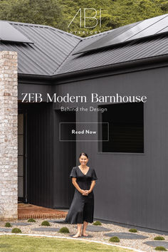 a woman standing in front of a building with the words zeb modern barnhouse behind her