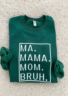 Transitioning from Ma to Mama to Mom to BRUH may seem daunting, but let's be real, being a mom is the BOMB! Show your love for the hustle of parenthood with this adorably comfy sweatshirt. Don't forget to snag some for your mommy squad and revel in the enchanted green and charming blue tones! True to Size. Unisex Fit. See size chart for details. 50% Cotton, 50% Polyester. Mother's Day Cotton Sweatshirt With Slogan, Navy Blue Sweatshirt, Being A Mom, Green Sweatshirt, The Bomb, Comfy Sweatshirt, Friends Mom, Blue Sweatshirt, Be Real