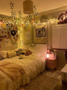 a bedroom with lots of lights and pictures on the wall above the bed in it