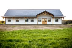 a large white building with the words june - bug farms written on it