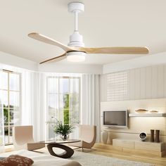 a living room with a ceiling fan in the middle of it's centerpiece