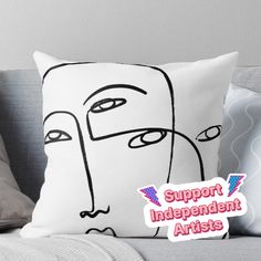 a pillow with the words support independent artists on it and an image of a woman's face