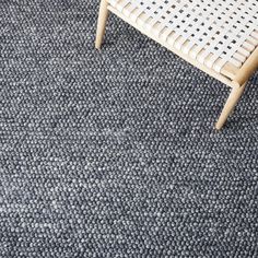 a chair sitting on top of a carpet covered floor