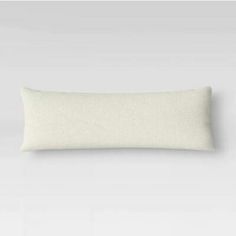 a white pillow on a gray background