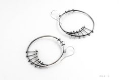 Drop Silver Hoop Earrings. Modern statement earrings. These standout hoops are really unique. SPECIFICATIONS: ~~ Material: Sterling Silver 925 ~~ Length 6.40 cm including the hook ~~ Width 5.00 cm ~~ Weight 11 grams for pair ~~ Finish: Oxidized and partly brushed to bring out the details. Get a 10% discount off your next order by subscribing at Diapiro's newsletter. Link for coupon code https://mailchi.mp/56f529763263/diapiro All of my products are carefully handmade with authentic techniques of Unique Dangle Hoop Earrings For Everyday, Contemporary Round Earrings For Everyday, Contemporary Everyday Round Earrings, Modern Hoop Wrap Earrings, Modern Pierced Hoop Wrap Earrings, Modern Handmade Hoop Wrap Earrings, Modern Oxidized Hoop Earrings For Everyday, Contemporary Hoop Earrings, Modern Oxidized Finish Hoop Earrings For Everyday