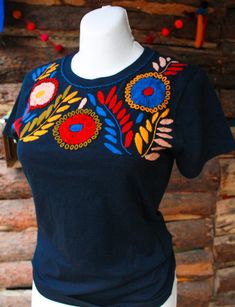 "Mexican embroidered shirt Beautiful embroidered blouse. This is handmade in Mexico. Perfect for those summer days at the beach, or for your fiesta parties. The embroidery colors may vary due all the handmade work (not the design). If you want an specific color, please send us a message so we can send you the ones available so you can choose. Size: Extra Small: 13\" width x 22\" long Small; 14\" width x 23\" long Medium: 15 1/2\" width x 24\" long (Width: shoulder - shoulder) Please also notice Mexican Party Favors, Mexican Wall Decor, Mexican Blouse, Mexican Outfit, Mexican Decor, Mexican Party, Fiesta Party, Colour Star, Embroidered Blouse