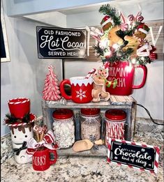 red mugs filled with candy and christmas decorations