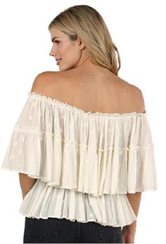 A bohemian babe's best friend, this beautiful and ethereal slightly sheer white tiered off-the-shoulder blouse is dreamy and drapes beautifully. Featuring on or off shoulder smocking, flattering layered tiers, and intricate eyelet details. Off-the-shoulder smocked neckline that will actually stay off the shoulder comfortably. Layered tiered tank eyelet detail. Slightly sheer layers. Lined in just the right places. Material: 100% Cotton. Suede Fringe Skirt, Barrel Racer, Fringe Skirt, Suede Fringe, Glitz And Glam, Long Maxi, Ruffle Top, Off Shoulder Blouse, Smocking