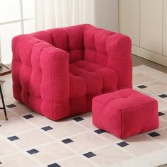 a red chair and ottoman in a room