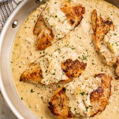 chicken with gravy in a pan on a table