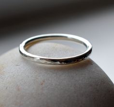 Hammer textured ripple effect ring band, lovingly hand crafted in recycled sterling silver. Handmade to order here in my jewellery studio using 1.8mm (13 gauge) round profile sterling silver wire, which I lightly hammer texture and form into a ring using traditional silver smithing techniques. I then hand polish it so it shines and catches the light beautifully. Each one is custom hand made to order in the size you request. Just select your ring size from the box and allow me up to one week to m Hammer Texture Ring, Textured Ring Band, Silver Smithing, Jewellery Studio, Round Profile, Hammered Rings, Textured Ring, Jewelry Studio, Recycled Sterling Silver