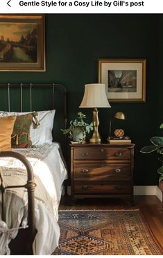 a bedroom with green walls and pictures on the wall