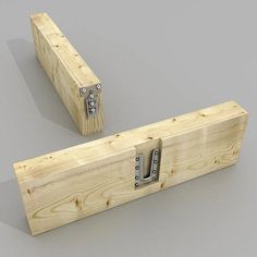 two pieces of wood with metal latches on each side and one piece missing from the other