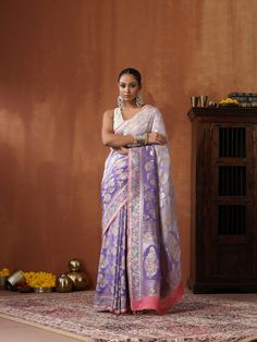 An exclusive saree from Khinkhwab. Add a dash of your favorite color to your ethnic look with this beautiful Banarasi saree from our Secret Garden collection. The Saree is made of pure Georgette and has the illustrious flower woven. Jaal weave is inherent to Banarasi weaving and this saree is the epitome of the craftsmanship of the renowned weavers of Banaras. Purple Tussar Silk Saree With Meenakari, Purple Meenakari Tussar Silk Saree, Designer Purple Saree With Zari Weaving, Designer Purple Meenakari Dupatta, Traditional Purple Meenakari Saree, Designer Jamawar Handloom Saree, Unstitched Meenakari Saree, Purple Jamawar Saree With Cutdana, Purple Meenakari Jamawar Saree