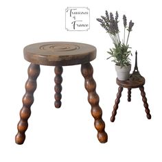 two small wooden stools with flowers on them